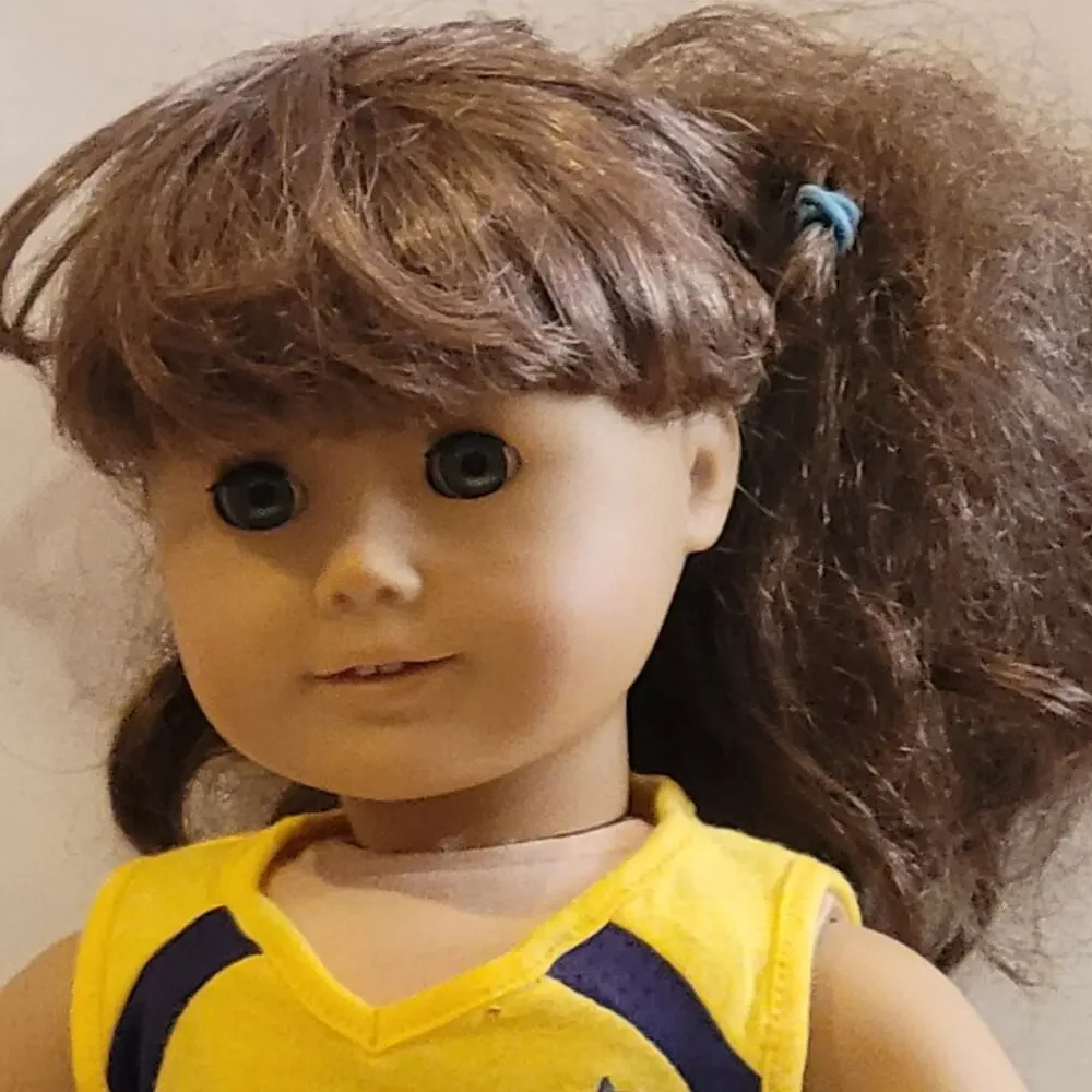 American Girl Doll Grey eyes light brown  hair.